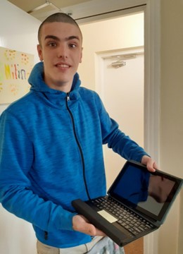 Aiden and his donated tablet