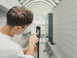 A man using a 360-degree camera